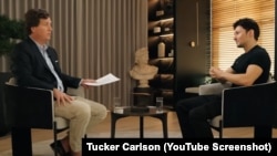 FILE - A YouTube screenshot of American conservative Tucker Carlson interviewing Russian IT businessman Pavel Durov in April 2024. The audience included scammers promoting dubious investment schemes on social media.