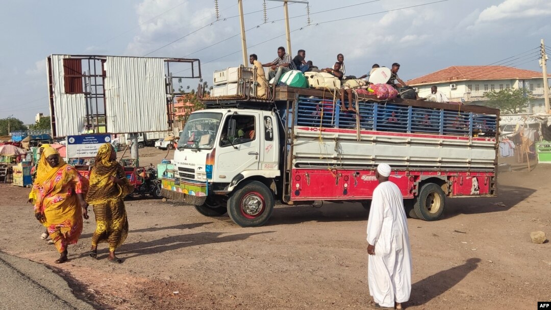 FILE - Sudanese fleeing Sennar after an attack by the Rapid Support Forces on nearby Jebel Moyain arrive on June 28, 2024, in Gedaref. Activists reported on July 4, 2024, that some 25 people fleeing the fighting drowned trying to cross the Nile River.