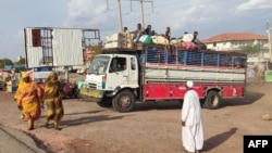 FILE - Sudanese fleeing Sennar after an attack by the Rapid Support Forces on nearby Jebel Moyain arrive on June 28, 2024, in Gedaref. Activists reported on July 4, 2024, that some 25 people fleeing the fighting drowned trying to cross the Nile River.