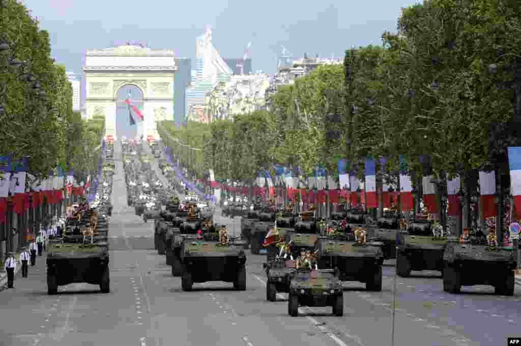 French soldiers from the Signal Regiment parade on the Champs-Elysees avenue during the annual Bastille Day military parade in Paris, on July 14, 2012. 