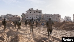 Ізраїльські солдати діють у секторі Газа на тлі триваючого конфлікту між Ізраїлем і палестинським ісламістським угрупованням ХАМАC. 20 січня 2024 року. Армія оборони Ізраїлю/REUTERS