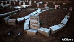 Graves of Kurdds killed fighting alongside People's Protection Units (YPG) against Islamic State (IS) jihadists for control of Kobani, Syria, Suruc, Turkey, Oct.15, 2014.