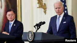 FILE - U.S. President Joe Biden and South Korea's President Moon Jae-in hold a joint news conference after a day of meetings at the White House, in Washington, May 21, 2021.