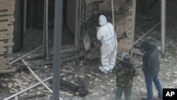 Investigators work near a scooter at the place where Igor Kirillov, head of Russia's Nuclear, Biological, and Chemical Defense Forces, and his assistant were killed by an explosive device in Moscow, Dec. 17, 2024.