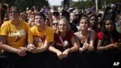 Supporters listen to President Barack Obama at a campaign event at Iowa State University, Ames, Iowa, Aug. 28, 2012.