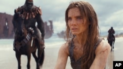This image released by 20th Century Studios shows Freya Allan in a scene from "Kingdom of the Planet of the Apes."