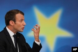 French President Emmanuel Macron delivers a speech on the European Union at the amphitheater of the Sorbonne university in Paris, France, Sept. 26, 2017. Macron is laying out his vision for a more unified Europe despite Brexit looming.