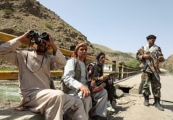 Armed men who are against Taliban uprising guard their check post, at the Ghorband District, Parwan Province, Afghanistan, June 29, 2021.