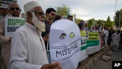 Pakistanis attend a rally to demand information about missing people who were reportedly picked up by security agencies during anti-al-Qaida raids, in Islamabad, Pakistan, Aug. 30, 2017. Scores of family members of the missing families joined civil society members and human rights activists on the occasion of the "International Day of the Victims of Enforced Disappearances."