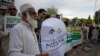 FILE - Pakistanis attend a rally to demand information about missing people who were reportedly picked up by security agencies during anti-al-Qaida raids, in Islamabad, Pakistan, Aug. 30, 2017. Scores of family members of the missing families joined civil