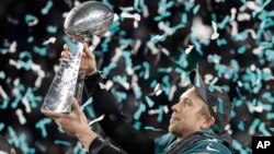 Nick Foles of the Eagles holds up the Vince Lombardi trophy after winning Super Bowl 52 on February 4, 2018. (AP Photo/Chris O'Meara)