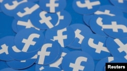 FILE - Stickers bearing the Facebook logo are pictured at Facebook Inc's F8 developers conference in San Jose, California, April 30, 2019.