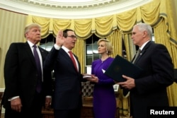 U.S. President Donald Trump, left, watches as Vice President Mike Pence, right, swears in Steve Mnuchin as Treasury Secretary next to his fiancé, Louise Linton, in the Oval Office of the White House in Washington, Feb. 13, 2017.