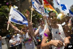 Israelis and tourists march during the Gay Pride Parade in Tel Aviv Israel, June 9, 2017. About 200,000 people from the LGBT community in Israel and abroad attended in Tel Aviv's annual gay pride parade.