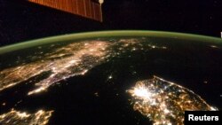 A NASA image shows a photo taken by the Expedition 38 crew aboard the International Space Station (ISS) of the night view of the Korean Peninsula.