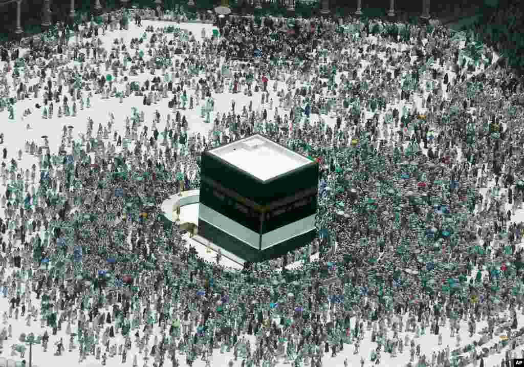 Muslim pilgrims circumambulate around the Kaaba, the cubic building at the Grand Mosque, in the Muslim holy city of Mecca, Saudi Arabia.
