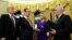 U.S. President Donald Trump, left, watches as Vice President Mike Pence, right, swears in Steve Mnuchin as Treasury Secretary next to his fiancé, Louise Linton, in the Oval Office of the White House in Washington, Feb. 13, 2017. 