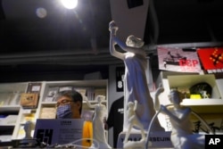 FILE - A small replica of the Goddess of Democracy is displayed at the June 4th Museum in Hong Kong, May 20, 2020.