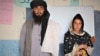 Mia Khan standing next to his daughter, Rozai. (Courtesy: Swedish Committee for Afghanistan)