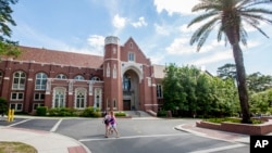 FILE - Students stroll across the campus of Florida State University in Tallahassee, Florida, April 30, 2015.
