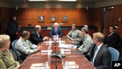Mike Pence before a briefing on missile defense with Alaska Gov. Bill Walker and Gen. Lori J. Robinson, Commander, U.S. Northern Command and North American Aerospace Defense Command, in Alaska, Feb. 5, 2018.