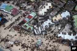 This photo provided by the Dutch Defense Ministry shows storm damage in the aftermath of Hurricane Irma, in St. Maarten, on Sept. 6, 2017.