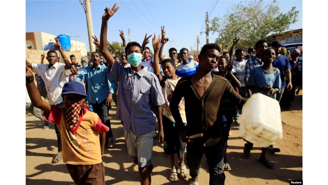Sudanese demonstrators march during anti-government protests in Khartoum, Sudan, Jan. 24, 2019.