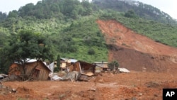 Structures lay in ruins at the site of a landslide in the village of La Pintada, Mexico, Sept. 19, 2013.