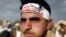 FILE - A Houthi supporter wears a headband praising the Houthi movement for making drone aircraft as he attends a pro-Houthi rally in Sana'a, Yemen March 3, 2017. 