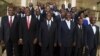 Ivory Coast's President Alassane Ouattara (C) poses with officials of his new government at the presidential palace in Abidjan, November 22, 2012. 