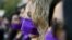 Women wear purple ribbons on their faces during the &quot;Todas en Silencio&quot; demonstration to mark the U.N.-designated International Women&#39;s Day, in front of La Moneda presidential palace in Santiago, Chile, March 8, 2017.