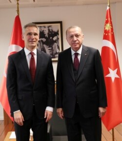 Turkish President Tayyip Erdogan meets with NATO Secretary General Jens Stoltenberg, left, in Brussels, Belgium, March 9, 2020.