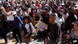 Students chant at the University of Cape Town as they protest for free education in Cape Town, South Africa, Sept. 20, 2016.