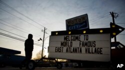 A sign greets drivers outside a shop in East Atlanta, Georgia, in DeKalb County, Jan. 9, 2017.