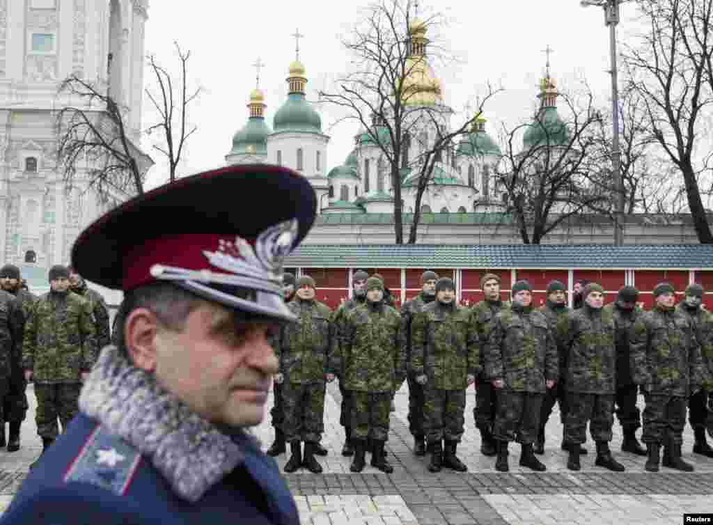 Members of the newly-created Ukrainian Interior Ministry battalion &quot;Saint Maria&quot; take part in a ceremony before heading to military training, in front of St. Sophia Cathedral, in Kyiv, Feb. 3, 2015.