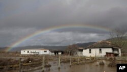 A rainbow appears over a flooded landscape in Hollister, California, Jan. 11, 2017. More than 40 percent of California has emerged from a punishing drought that covered the whole state a year ago, federal drought-watchers said.