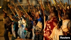 FILE - Miners on strike chant slogans as they march in Nkaneng township outside the Lonmin mine in Rustenburg 