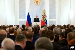 Russian President Vladimir Putin gives his annual state of the nation address before members of Federal Assembly in Moscow, Russia, Dec. 3, 2015.
