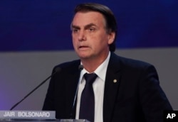 FILE - Jair Bolsonaro, who is running for president from the National Social Liberal Party, attends a presidential debate in Sao Paulo, Brazil, Aug. 9, 2018.