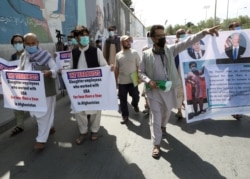FILE PHOTO: Former Afghan interpreters who worked with U.S. troops in Afghanistan demonstrate in Kabul