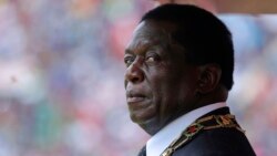 FILE - Zimbabwe's President Emmerson Mnangagwa prepares to inspect the guard of honour during the celebrations for the country's 38th anniversary of Independence at the National Sports Staduim in Harare, Wednesday, April, 18, 2018.