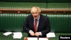 Britain's Prime Minister Boris Johnson speaks at the House of Commons during question period, amid the coronavirus disease outbreak, in London, Britain, May 20, 2020. 