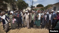 Kenyan Mau Mau War veterans and their supporters celebrate the announcement of a legal decision in Britain's High Court concerning Mau Mau veterans in Nairobi, Kenya, October 5, 2012.