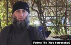 A screenshot depicting Islam Atabiev, aka Abu Jihad, from a YouTube IS propaganda video.