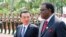 FILE - China's Premier Li Keqiang, left, talks to Namibia's Prime Minister Hage Geingob as they inspect an honor guard during a welcoming ceremony in Sanya, Hainan province, April 9, 2014. 