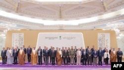 FILE - A handout picture provided by the Saudi Press Agency (SPA) on August 6, 2023 shows representatives posing for a group picture during a National Security advisors' meeting in Jeddah.