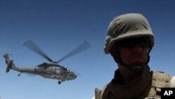 A medevac helicopter lifts off from Camp Nathan Smith in Kandahar city, carrying an unidentified NATO soldier on 9 June 2010
