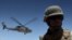 A medevac helicopter lifts off from Camp Nathan Smith in Kandahar city, carrying an unidentified NATO soldier on 9 June 2010