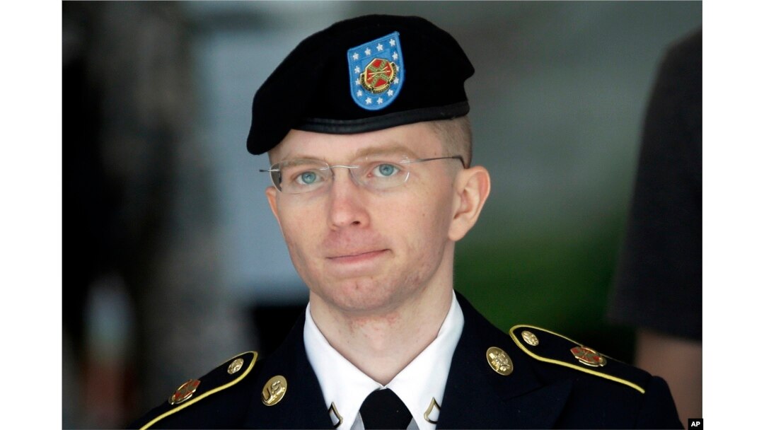FILE - Army Pvt. Chelsea Manning, then-Army Pfc. Bradley Manning, is escorted out of a courthouse in Fort Meade, Maryland, after the third day of his court martial, June 5, 2013.