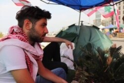 Ayman Debiane, 22, has been living in the protest camp for nearly four weeks, saying corruption in Lebanon is keeping young people out of work and impoverishing the people, pictured in Beirut on Nov. 14, 2019. (Heather Murdock/VOA)